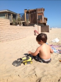 A little boy playing in the sand